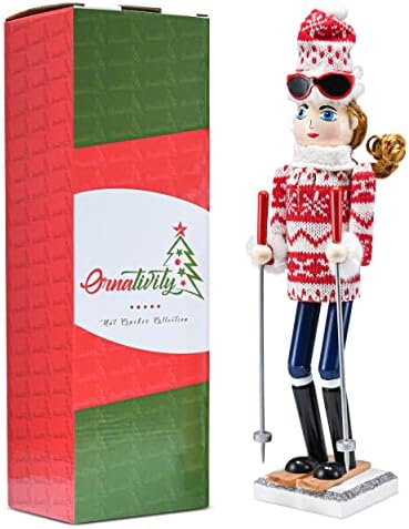 Орнативност Божиќна жена скијачка оревчеста - црвена и бела дрвена оревница жена со грда џемпер и скијачки стапчиња во скијање позираат Божиќ